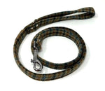 Dog leash with patterned design and metal clip on a white background