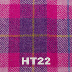 6oz Stainless Steel Hip Flask with Harris Tweed Wrap, held in hand to demonstrate its compact size and portability.