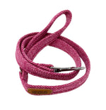Pink dog leash with a metal clip on a white background