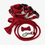 A set of British tweed dog collar, lead, and bow tie in red, displayed on a white background.