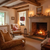 Cozy living room with fireplace, armchair, and decorative elements.